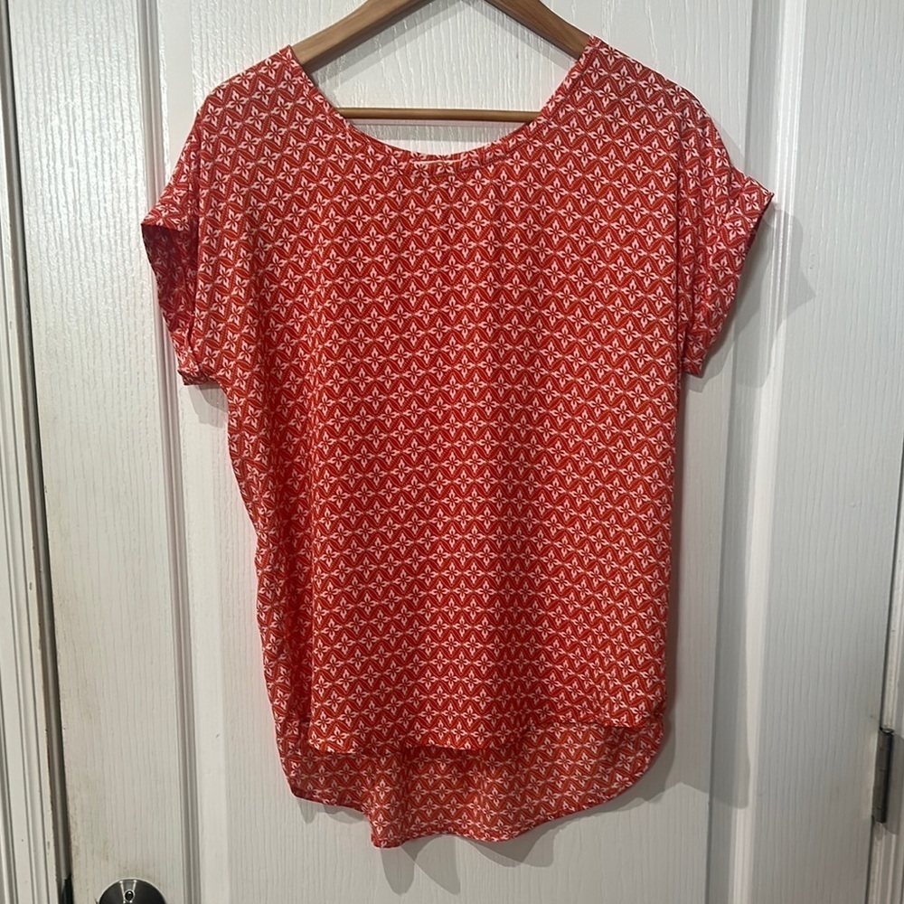 Pleione size s orange whole short sleeve high low top NWOT